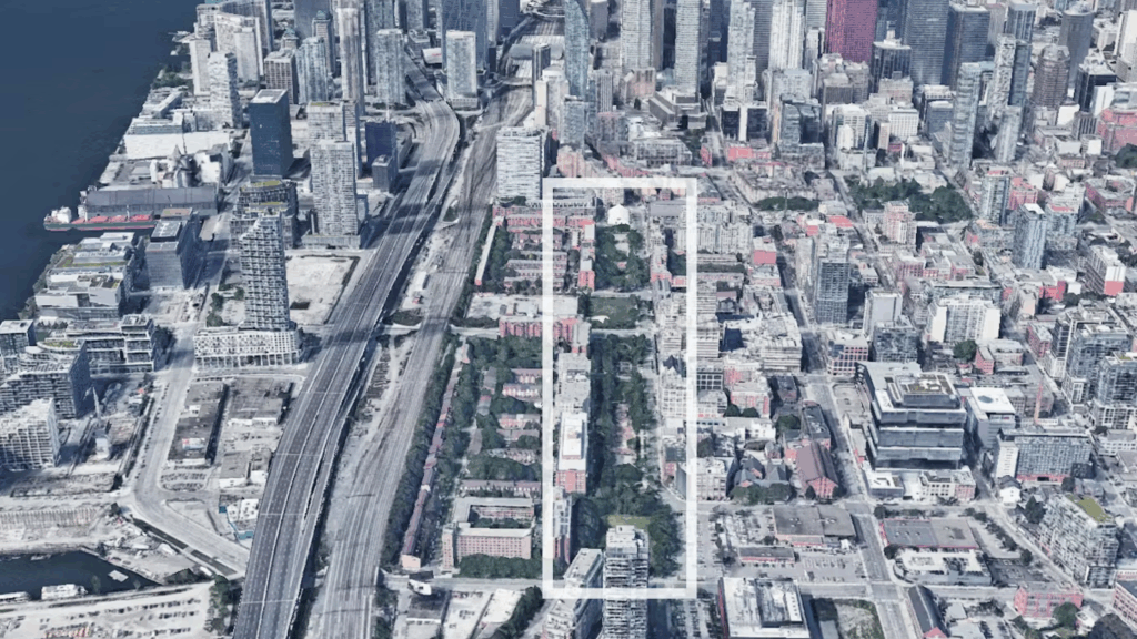 Aerial view of David Crombie Park site outlined in Toronto's dense St. Lawrence neighbourhood showing surrounding urban infrastructure and limited site access