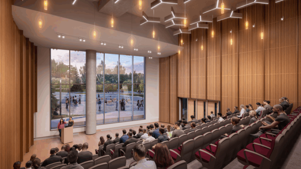Net-zero, custom-built, and culturally designed: what Ādisōke library reveals about modern civic construction 1 Ādisōke library Level 1 auditorium rendering showing acoustic wood wall paneling, integrated ceiling lighting, and floor-to-ceiling windows overlooking the public plaza